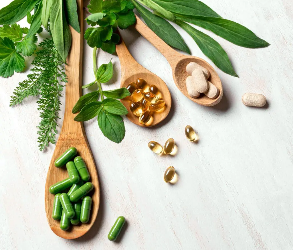Herbal supplements on wooden spoons