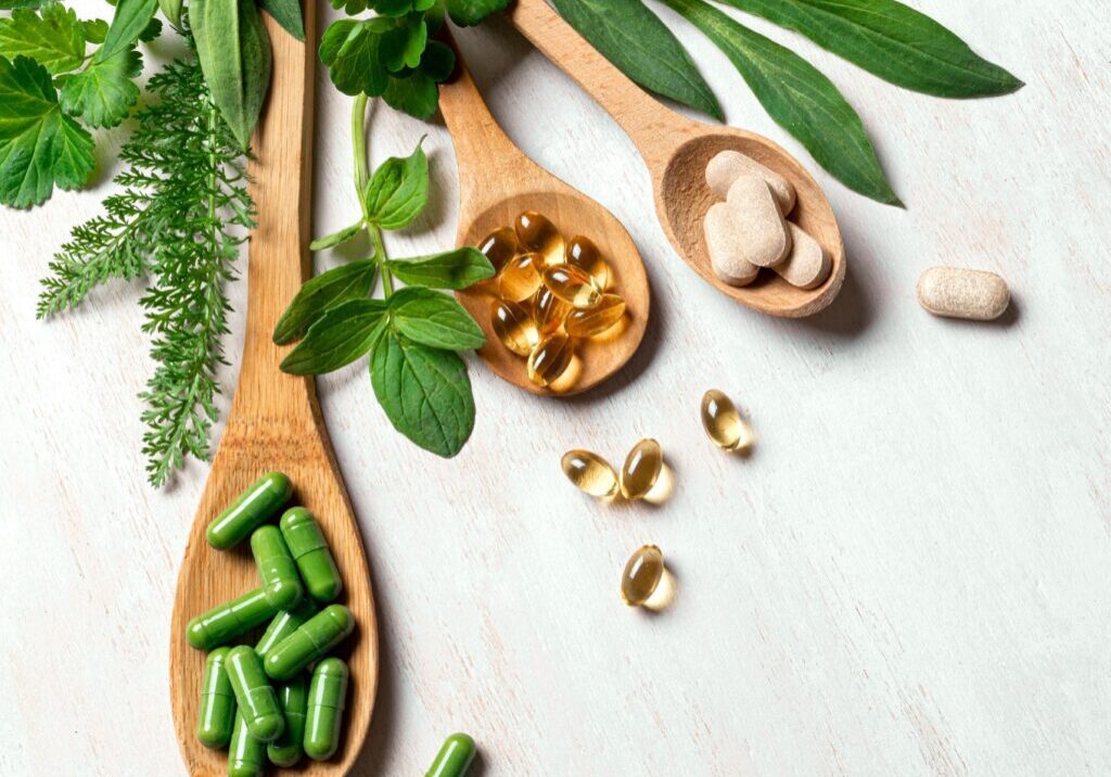 Herbal supplements on wooden spoons